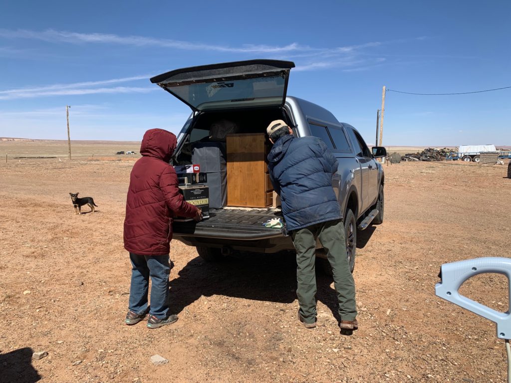 Joyce and Ronald helping unload the truck